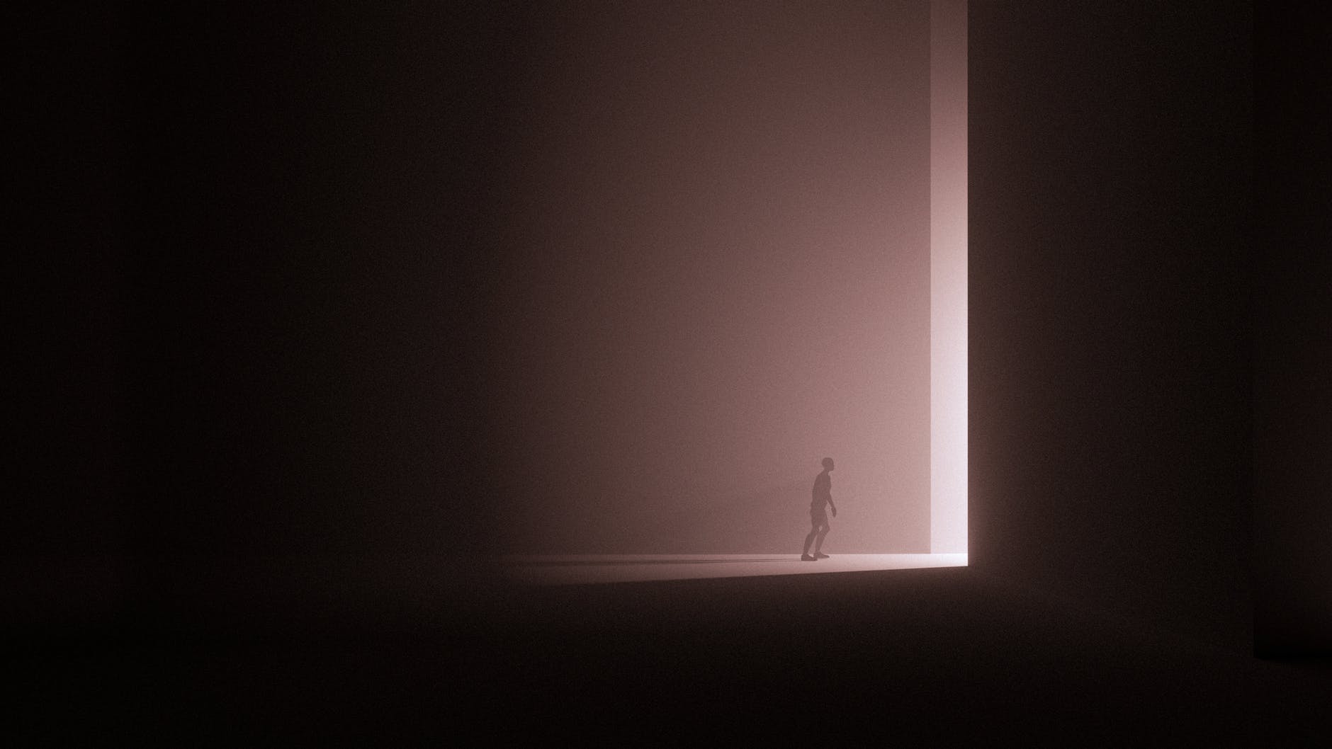 person in black shirt standing on white floor