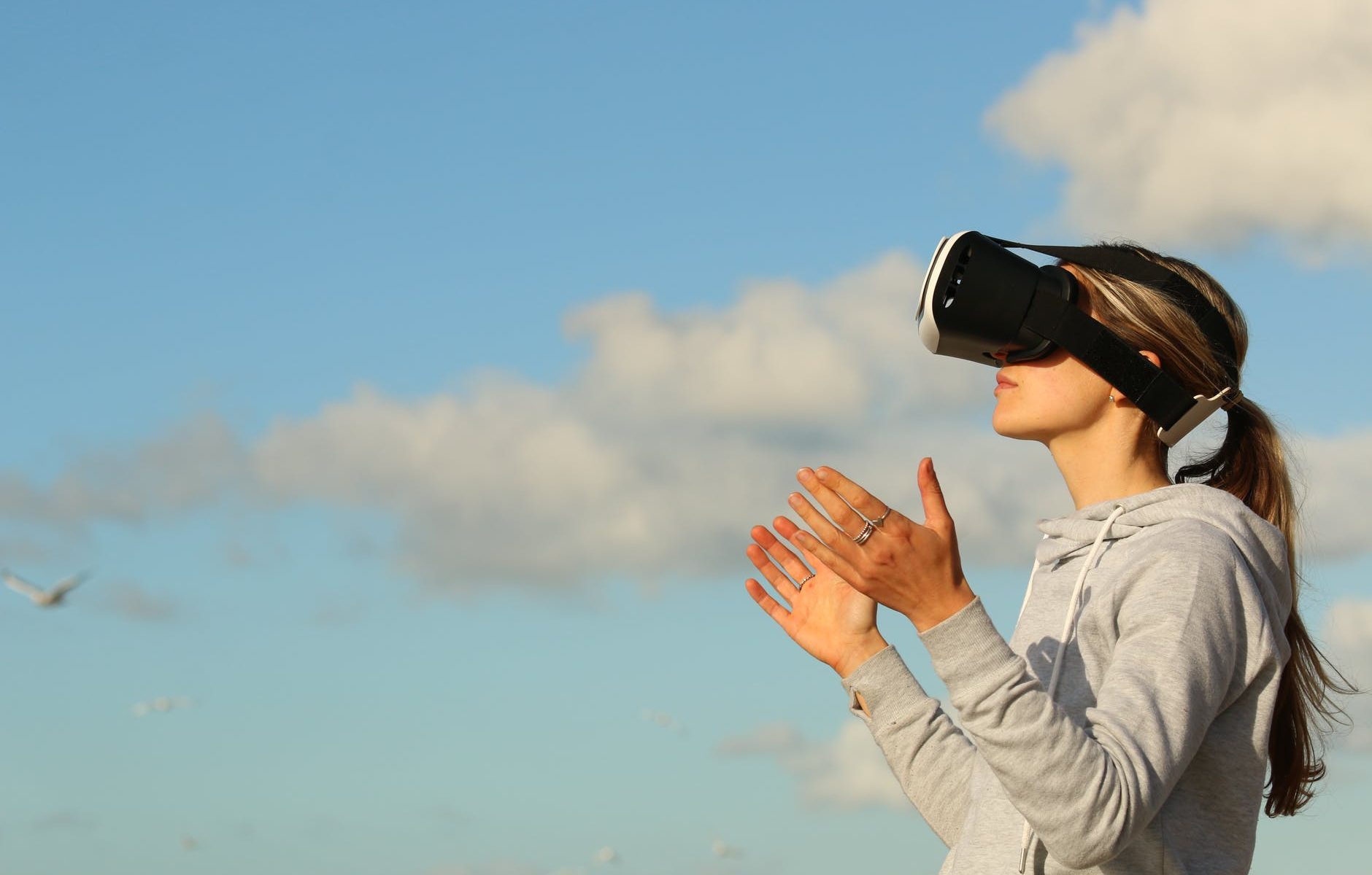 woman using vr goggles outdoors