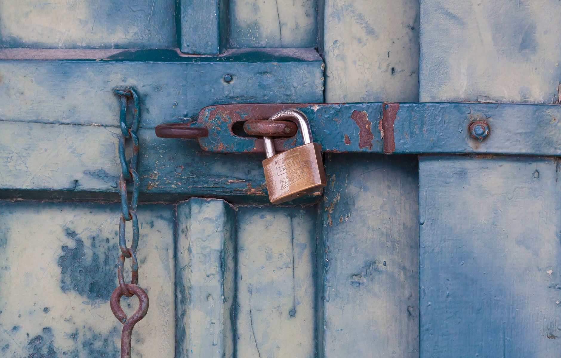 gold padlock locking door