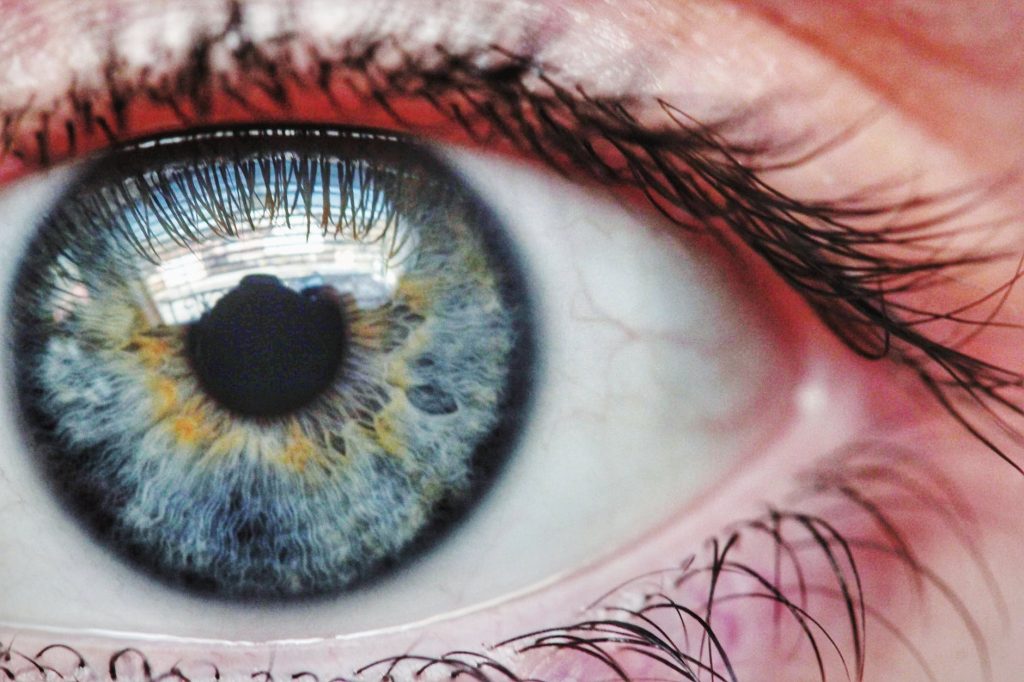 persons eye with blue eyes