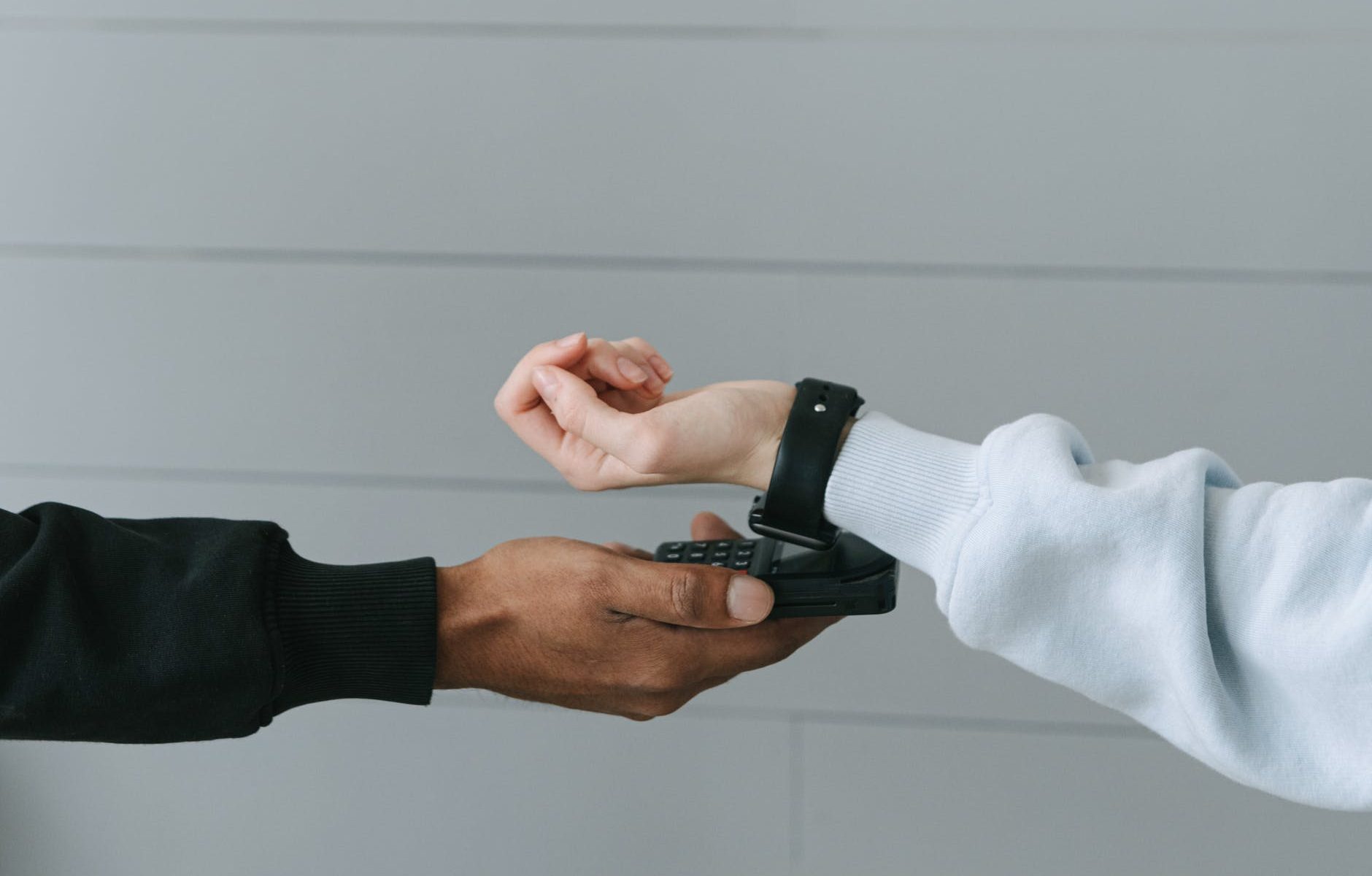 person paying using her smartwatch