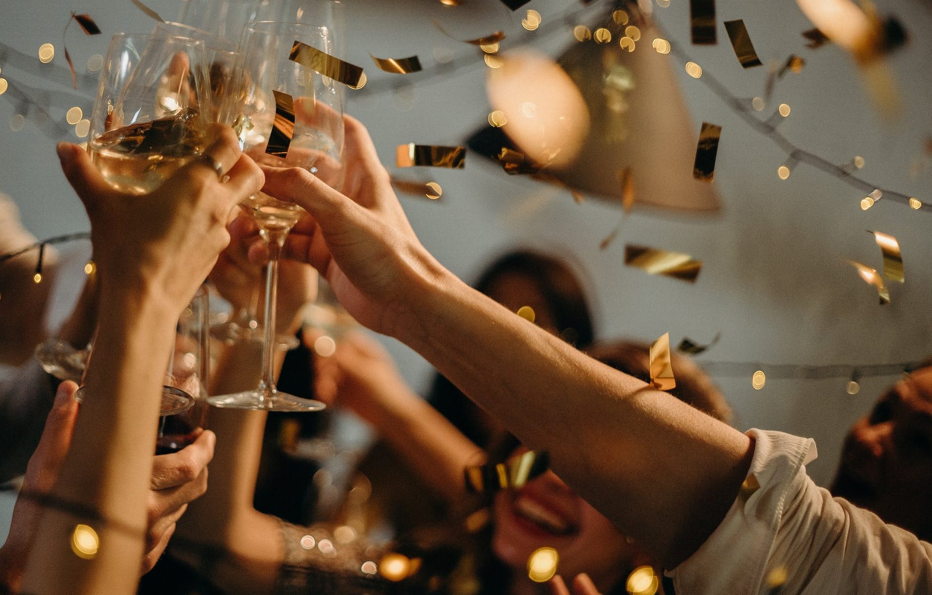 people toasting wine glasses