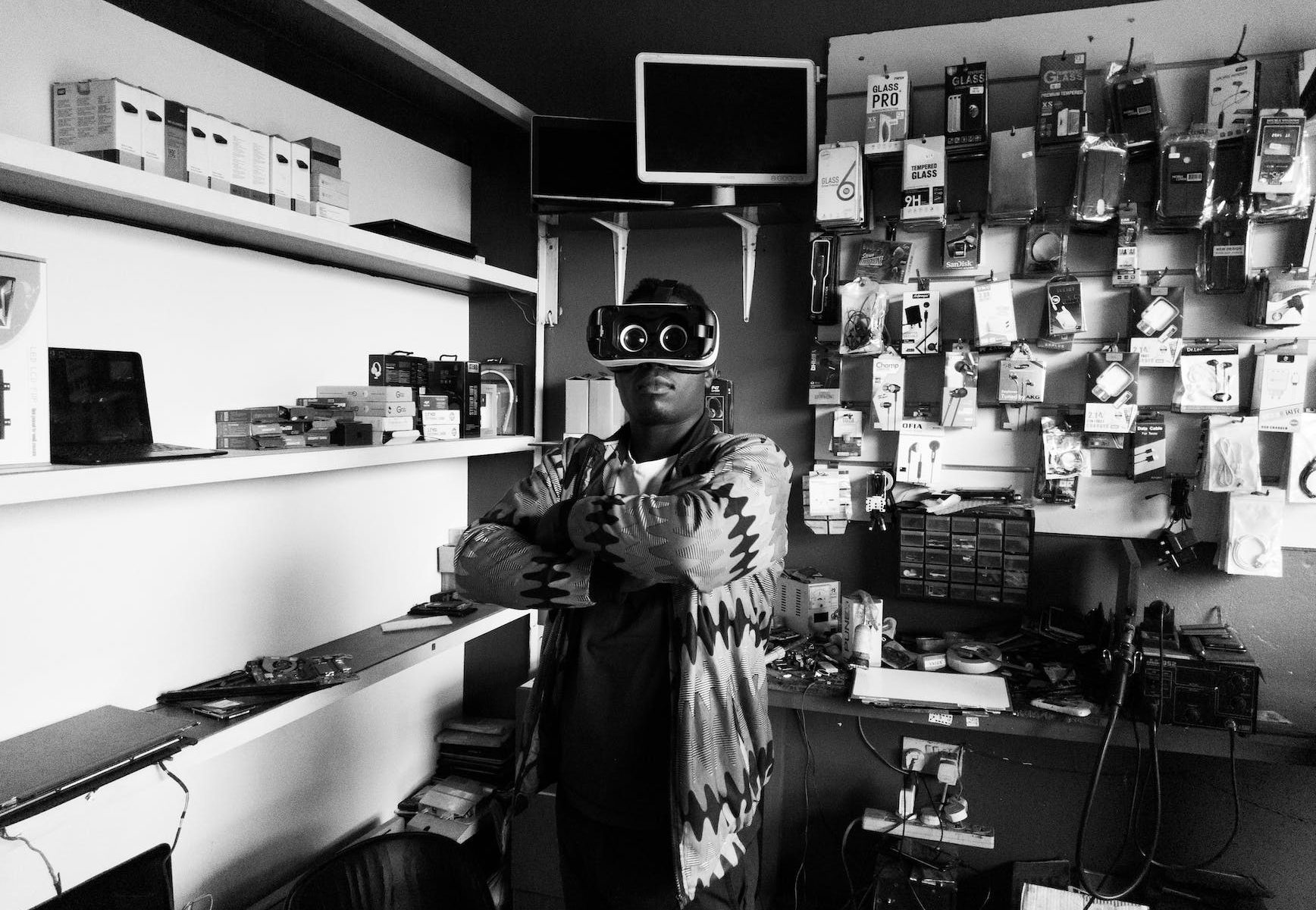 black man in vr goggles in electronics store