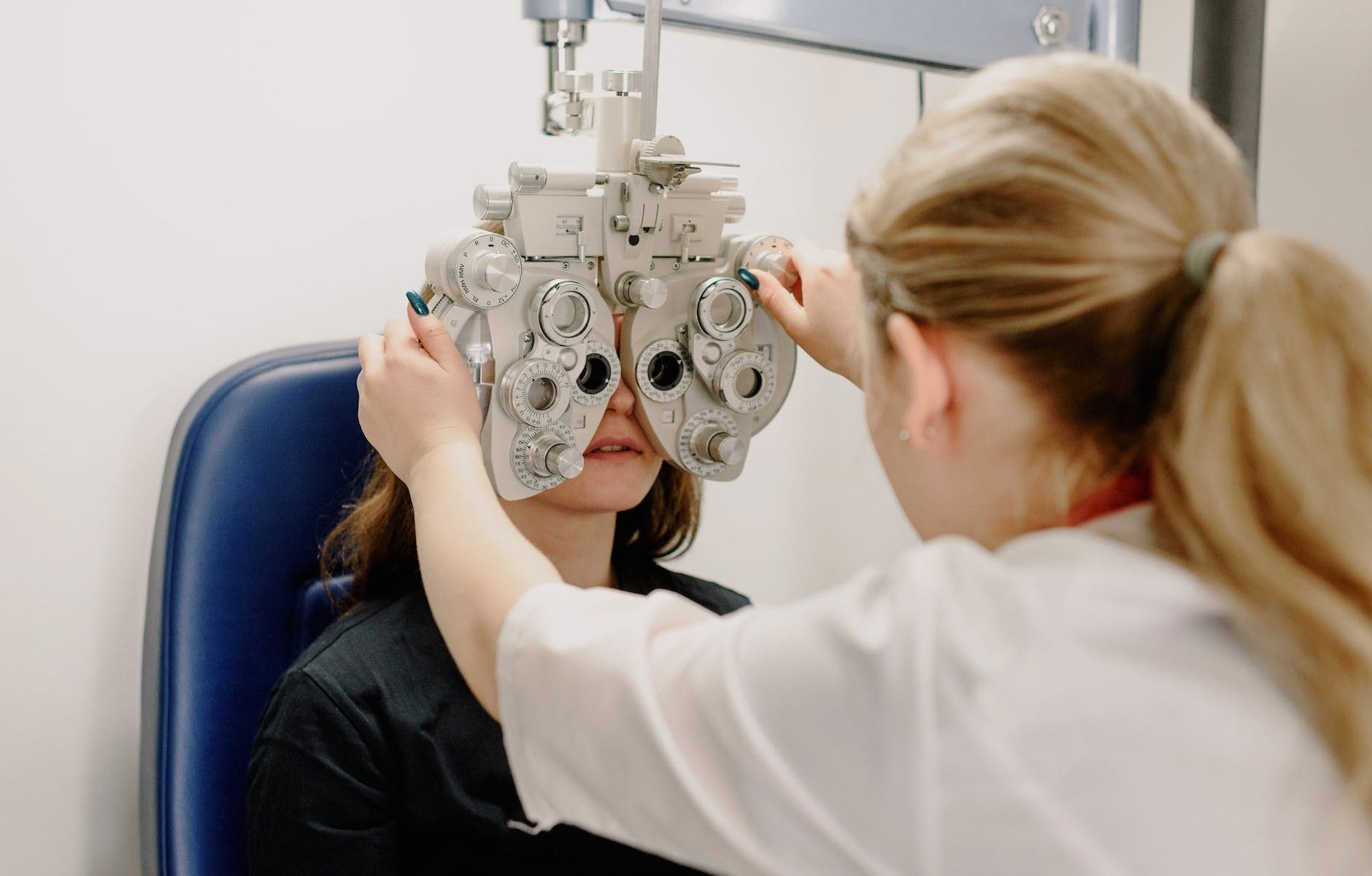 unrecognizable ophthalmologist checking vision of patient
