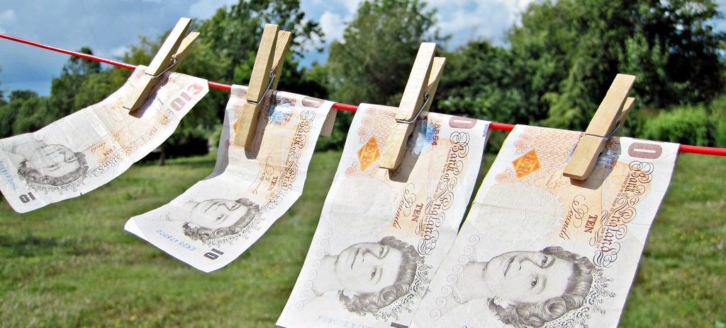 UK pounds being put on the washing line to be laundered with a green pasture and blue sky in the background. Like much of our work, we have put all these images in the public domain. Feel free to use them but please credit out site as the source if you do: TaxRebate.org.uk